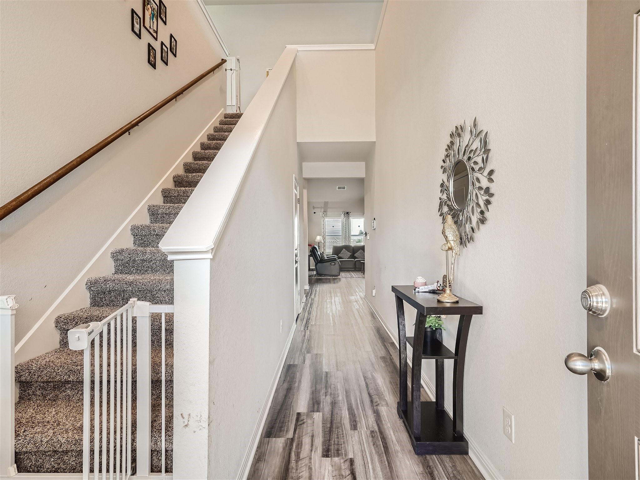 1416 Deering Run Leander, TX 78641 - Photo 6 of 21 a view of a hallway with wooden floor and staircase