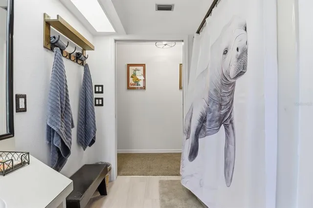 a bathroom with a sink and a shower curtain