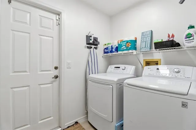 a utility room with dryer and washer