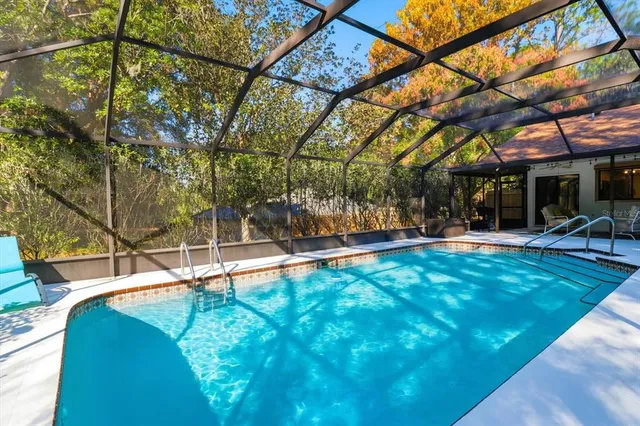 a view of a swimming pool with a patio