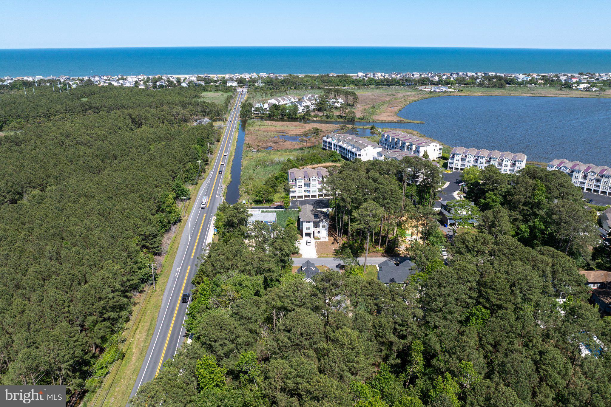 402 Salt Pond Road Bethany Beach, DE 19930 - Photo 54 of 55 Coastal serenity meets lush greenery.