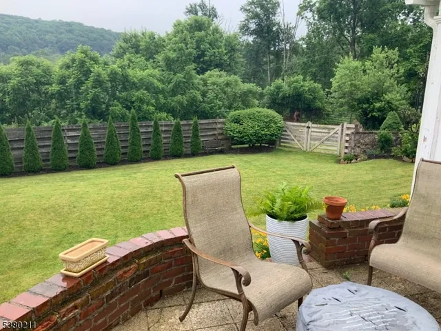 a view of a chairs and table in the patio