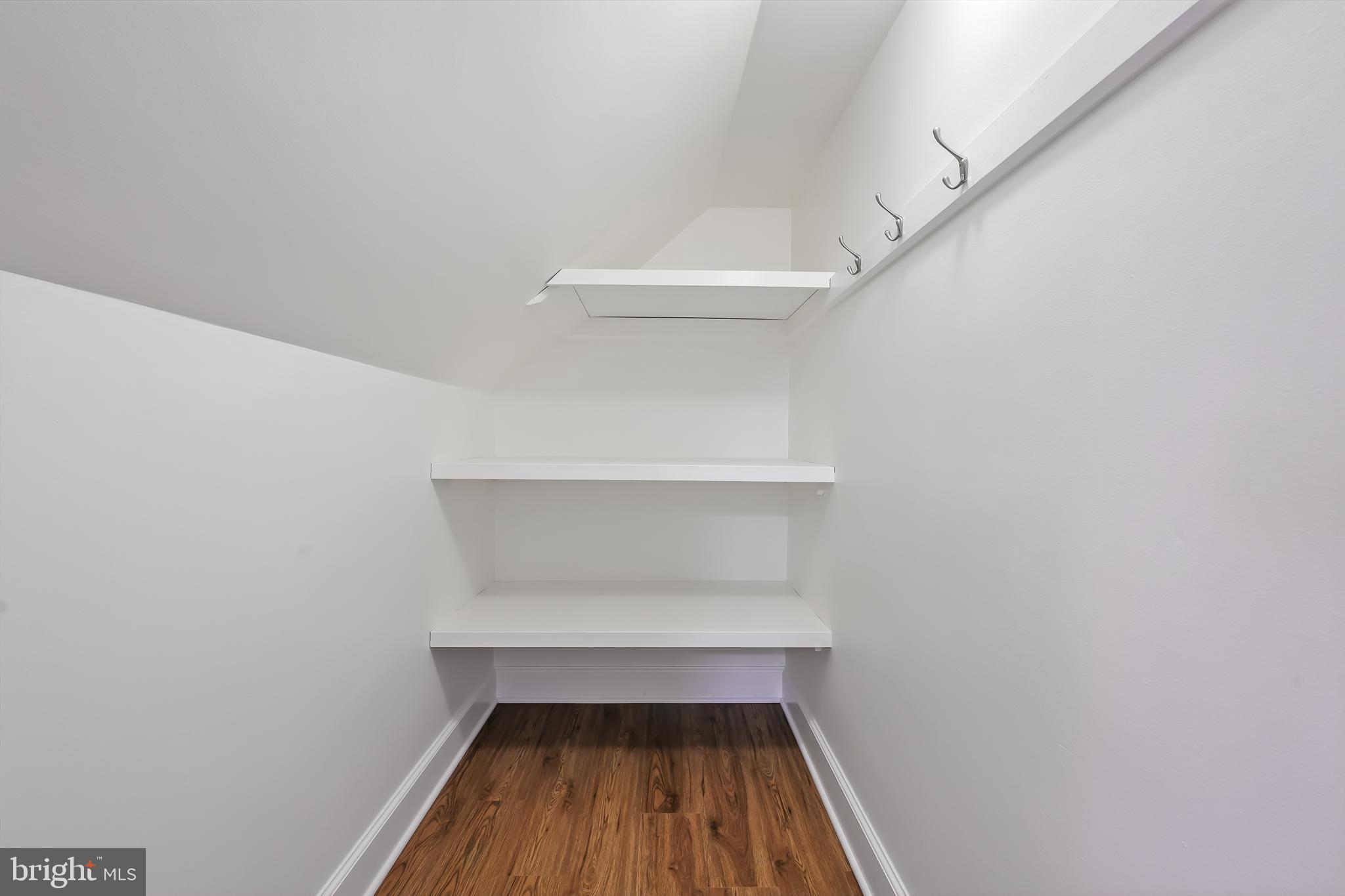 22 Center Meeting Road, Unit B Wilmington, DE 19807 - Photo 16 of 20 a small place has white door and a shelf