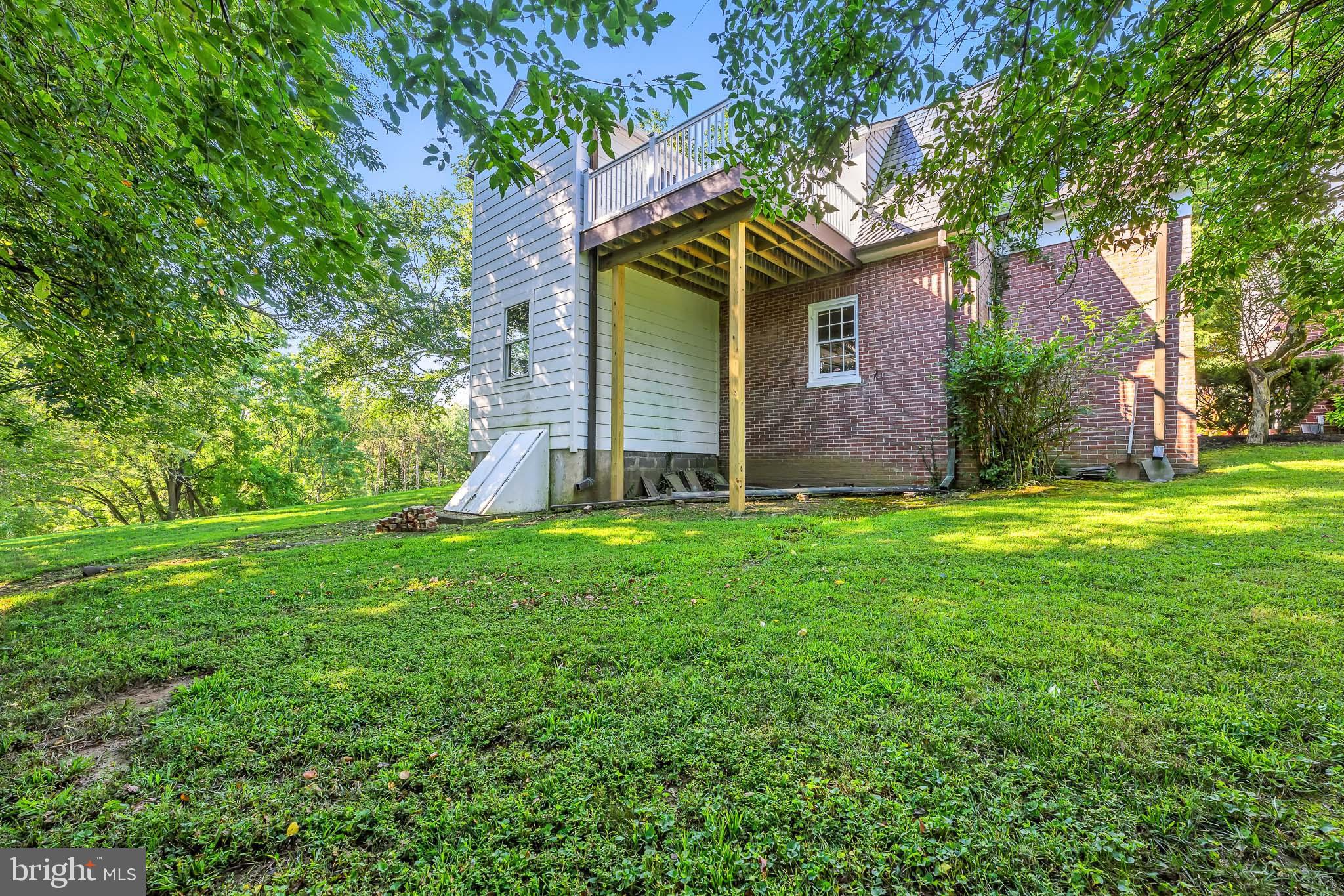 22 Center Meeting Road, Unit B Wilmington, DE 19807 - Photo 19 of 20 front view of a house with a yard