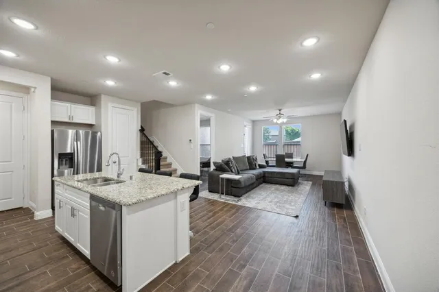 a very nice looking living room with wooden floor