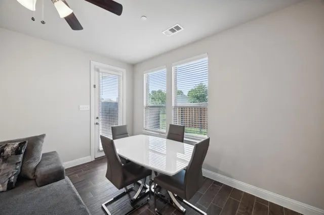 a view of a room with furniture and wooden floor