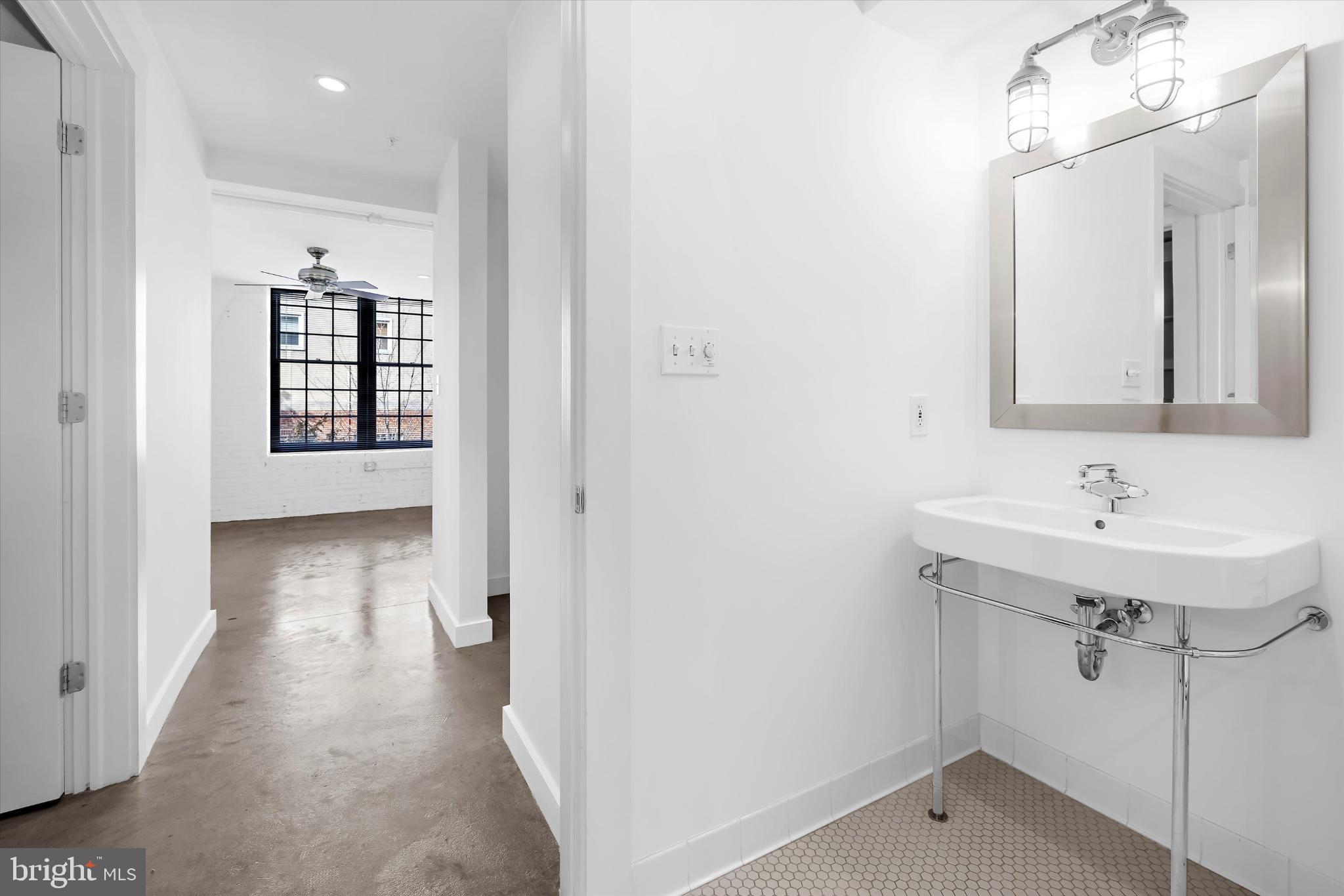 1220 Bank Street, Unit 303 Baltimore, MD 21202 - Photo 25 of 50 Main level ensuite bathroom