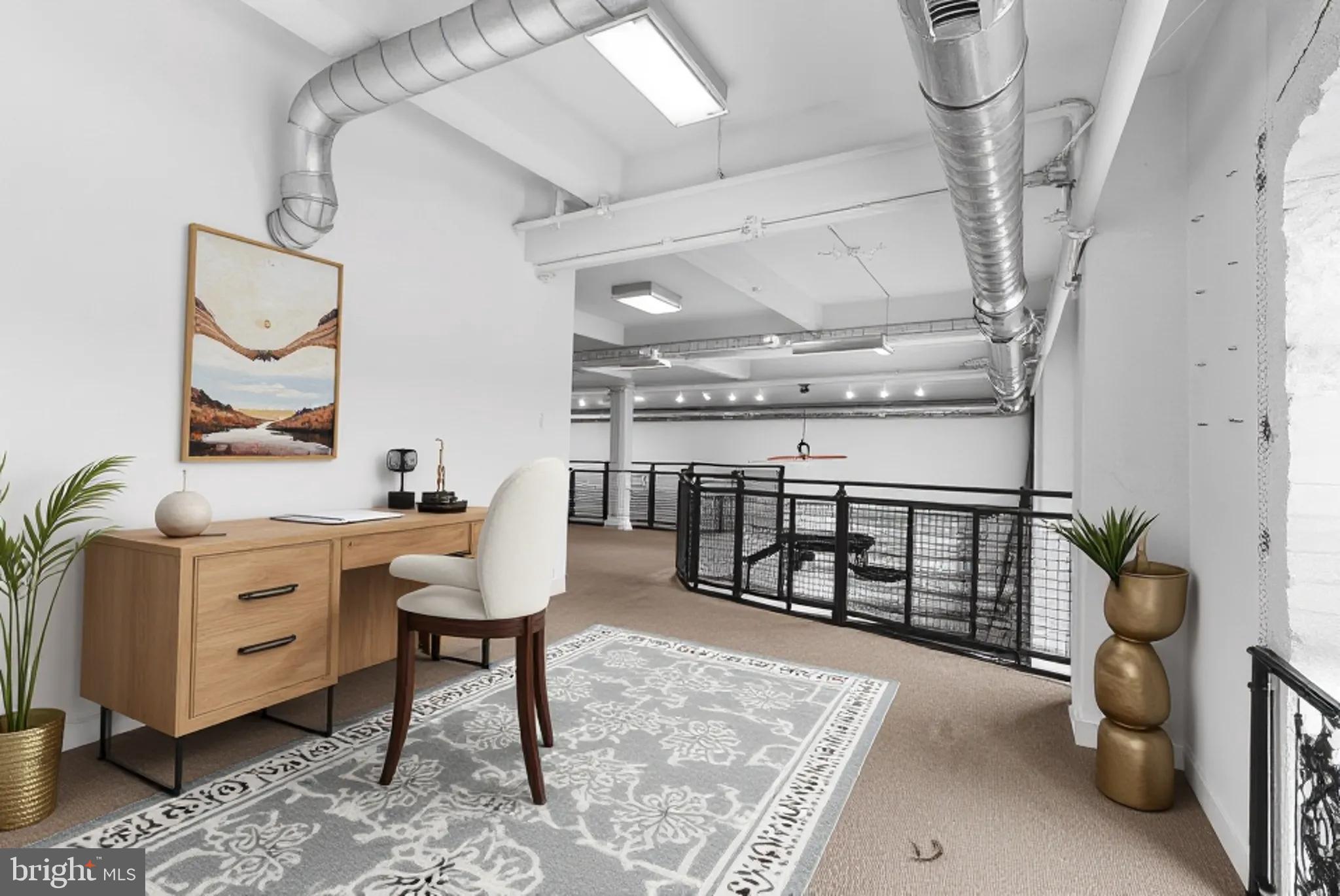 1220 Bank Street, Unit 303 Baltimore, MD 21202 - Photo 33 of 50 Virtually staged additional space in loft