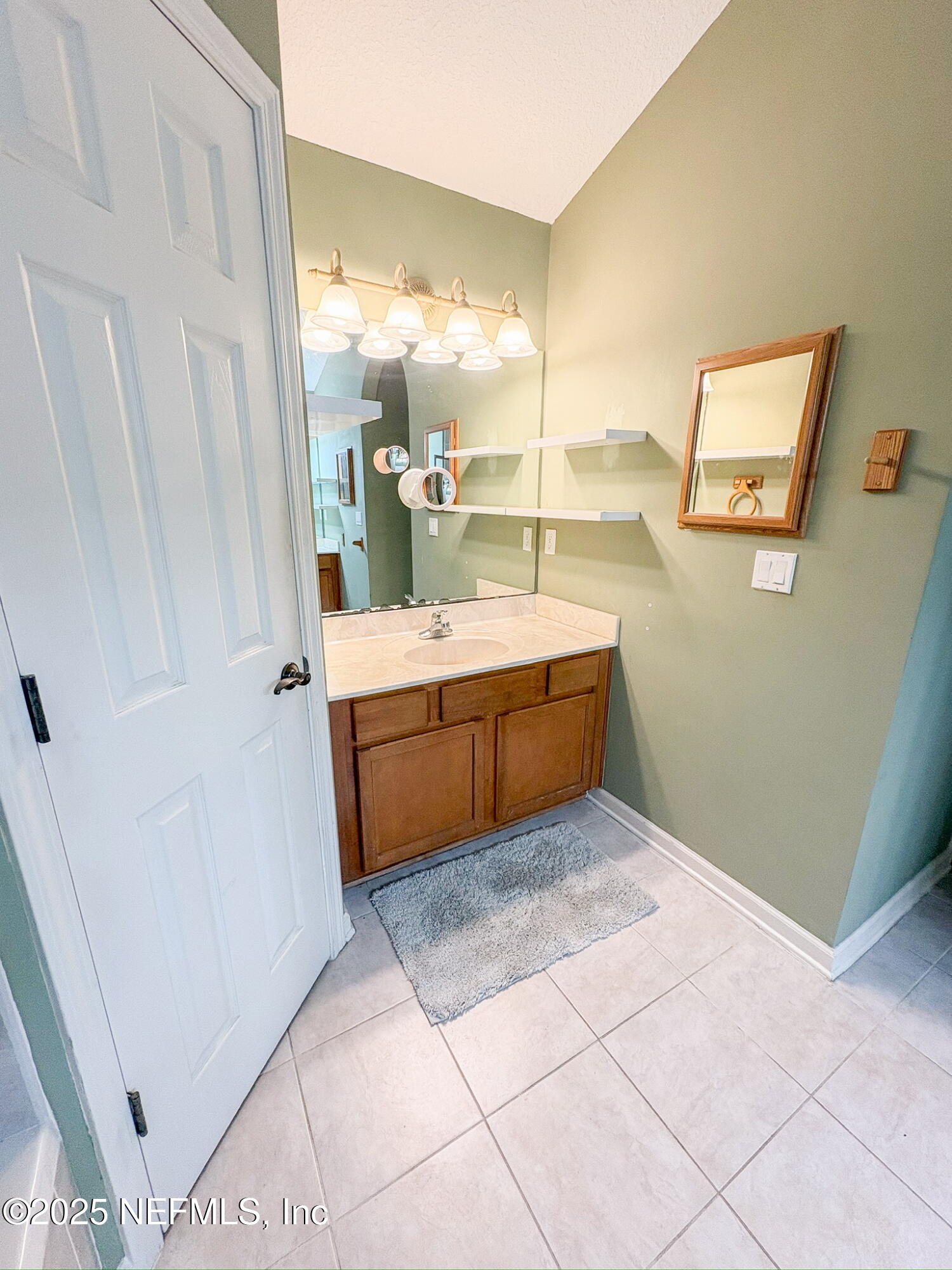 830 East Red House Branch Road St. Augustine, FL 32084 - Photo 15 of 25 a bathroom with a tub sink and mirror