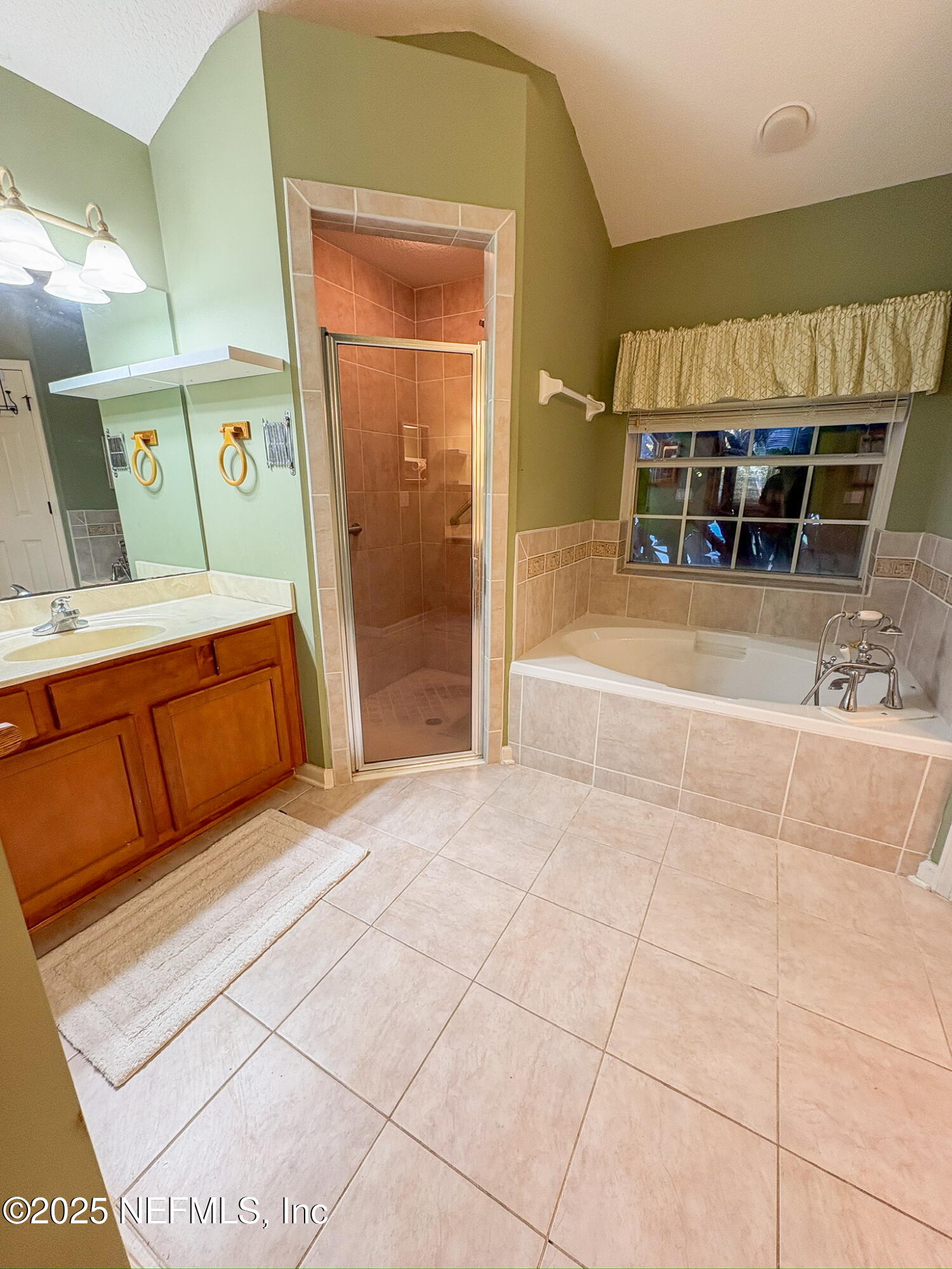830 East Red House Branch Road St. Augustine, FL 32084 - Photo 16 of 25 a spacious bathroom with a tub and shower