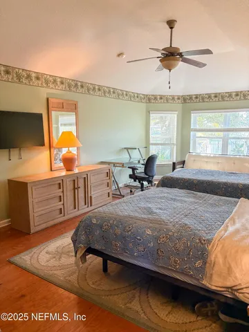 a living room with furniture pool table and a large window