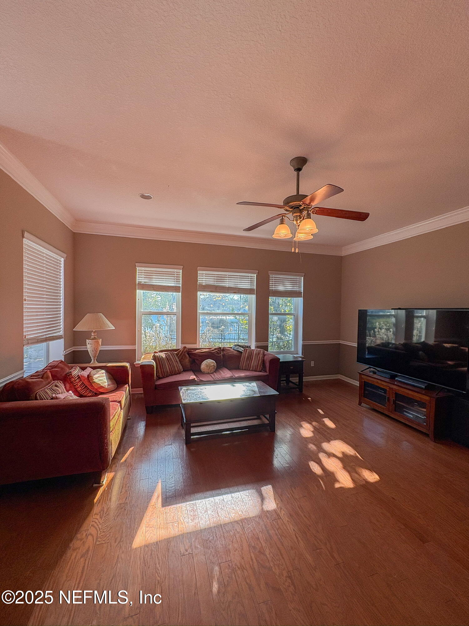 830 East Red House Branch Road St. Augustine, FL 32084 - Photo 23 of 25 a living room with furniture and a flat screen tv