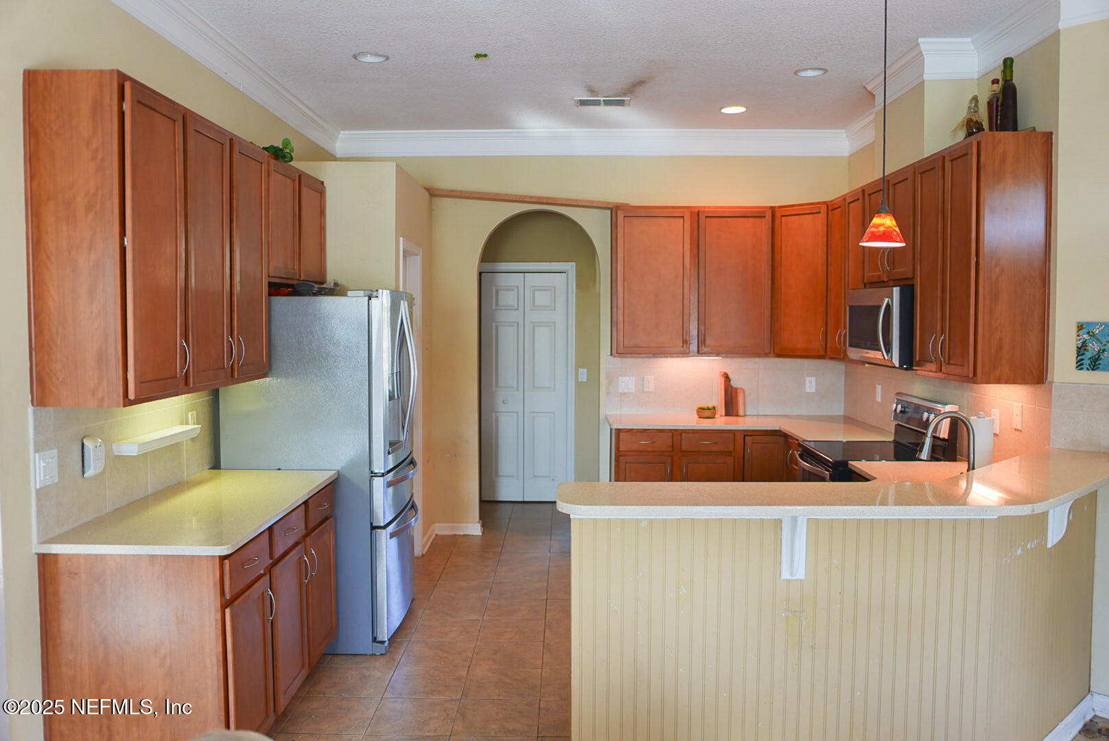 830 East Red House Branch Road St. Augustine, FL 32084 - Photo 4 of 25 a bathroom with a sink a mirror and a shower