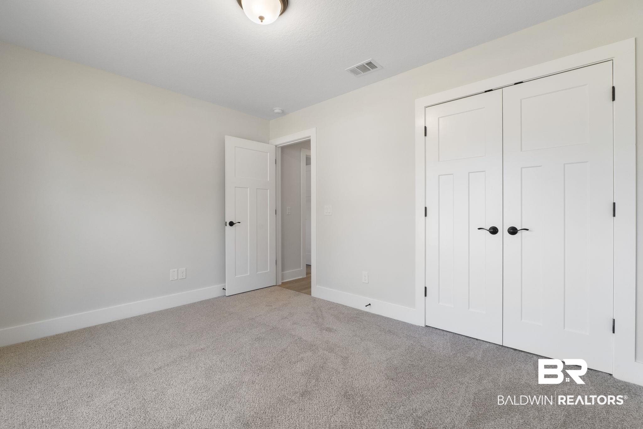 32563 Arbor Ridge Circle Lillian, AL 36549 - Photo 29 of 53 Unfurnished bedroom featuring carpet and a closet