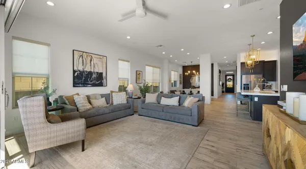 a large kitchen with a table and chairs