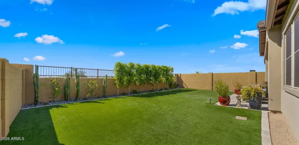 a living room with furniture and a view of kitchen