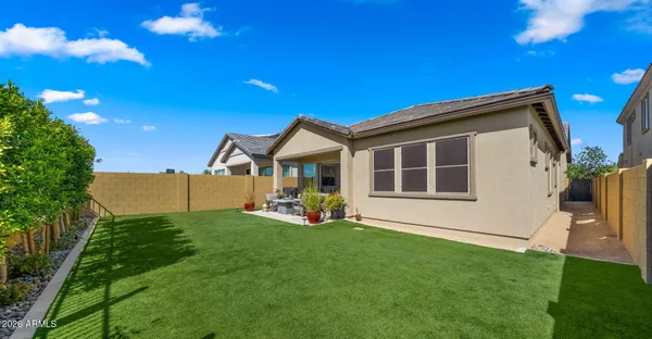 a view of an chairs and table in the patio
