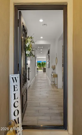 a front view of a house with plants