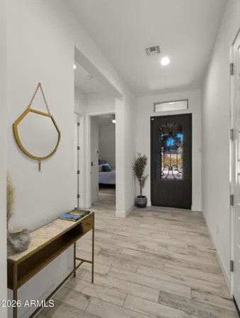 a view of a livingroom with furniture and a fan