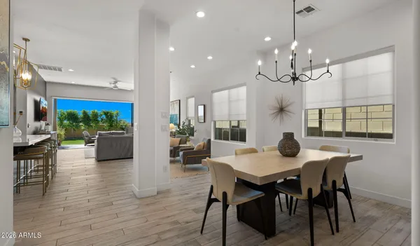 a view of living room with furniture and a chandelier