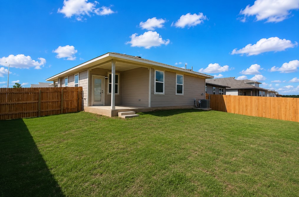 100 Century Plant Road Leander, TX 78641 - Photo 24 of 36 A spacious backyard with fresh green grass, offering privacy and an ideal setting for outdoor activities.