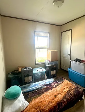 a bedroom with a bed and a couch