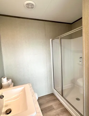 a bathroom with a bathtub and shower