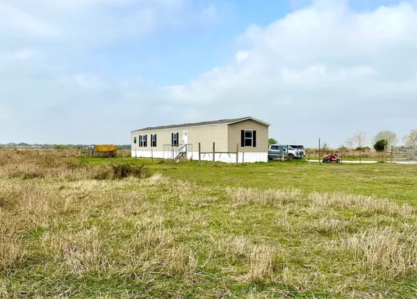 a view of building with an ocean