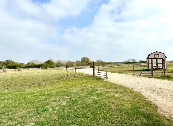 a view of a lake with a big yard