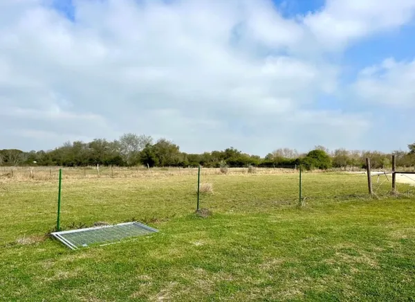 a view of a lake with a big yard
