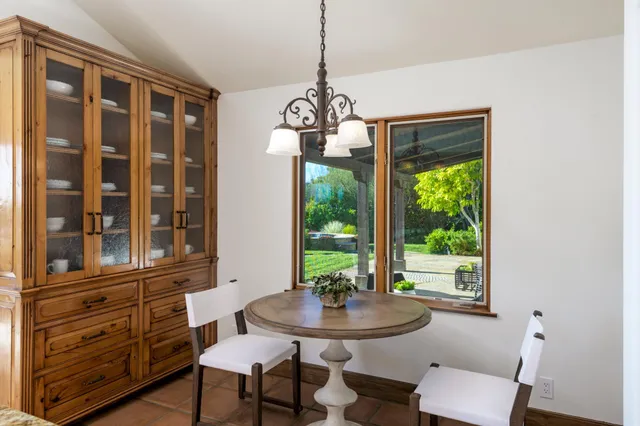 a view of a dining room with furniture window and outside view