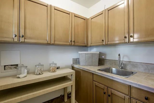 a kitchen with stainless steel appliances granite countertop a sink and cabinets