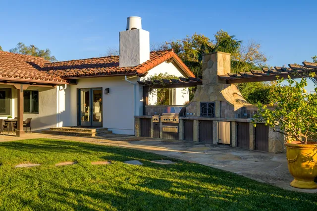 a front view of house with yard and seating area