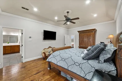 a spacious bathroom with a double vanity sink and a mirror