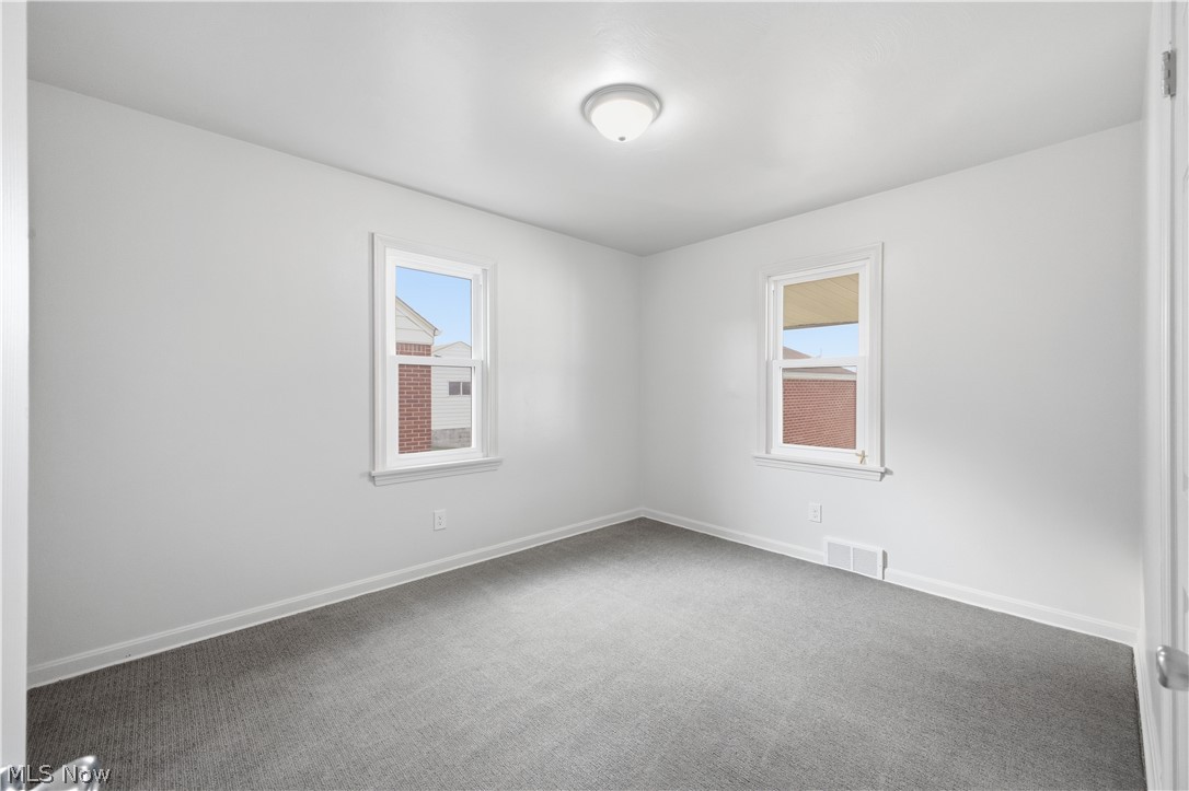227 Wilson Street Struthers, OH 44471 - Photo 20 of 44 Carpeted empty room with plenty of natural light