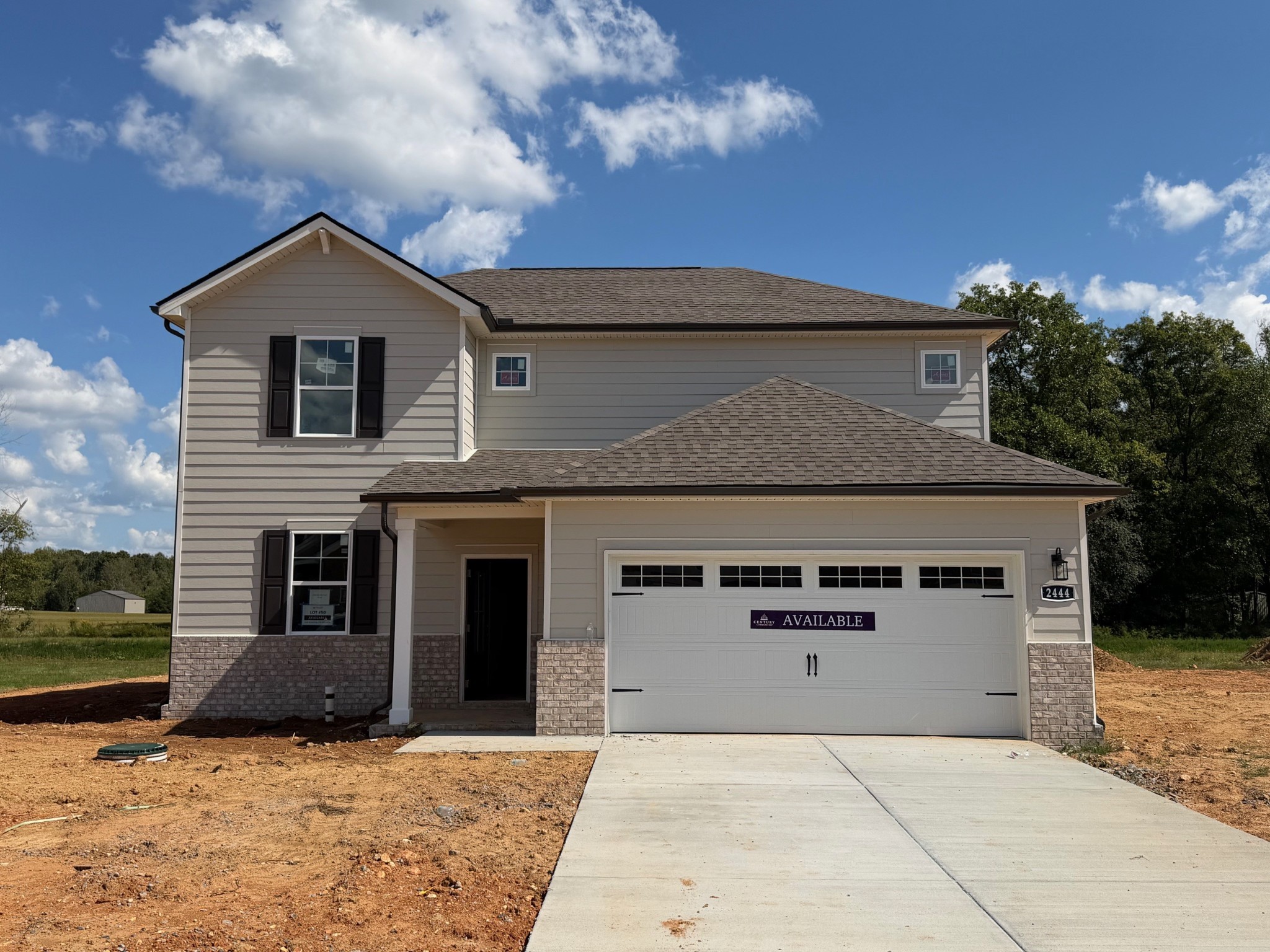 front view of a house with a yard