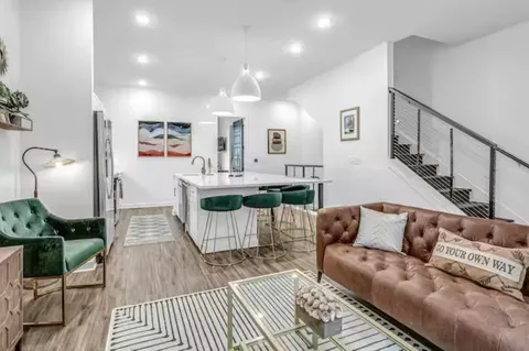 a living room with furniture and a table