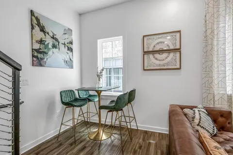 a view of a livingroom with furniture and wooden floor