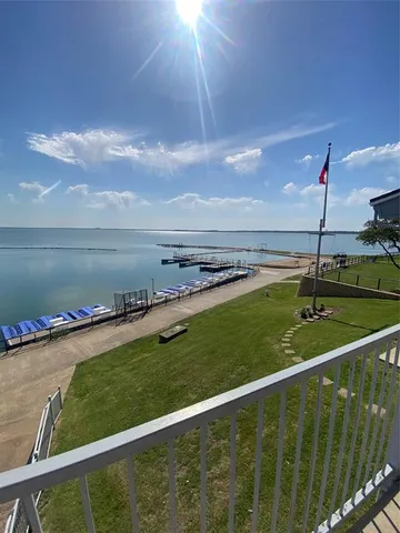 a view of a water fountain and a lake