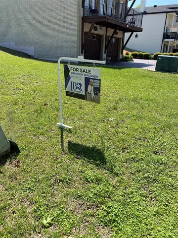 a view of a yard with an outdoor space