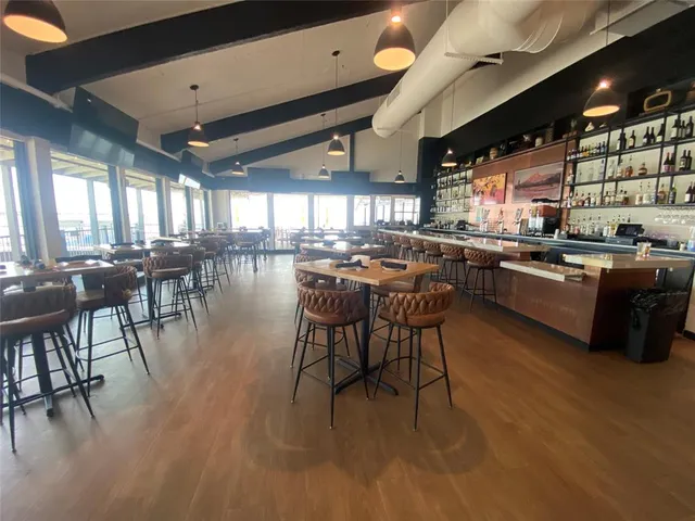 a kitchen with lots of counter top space and dining table