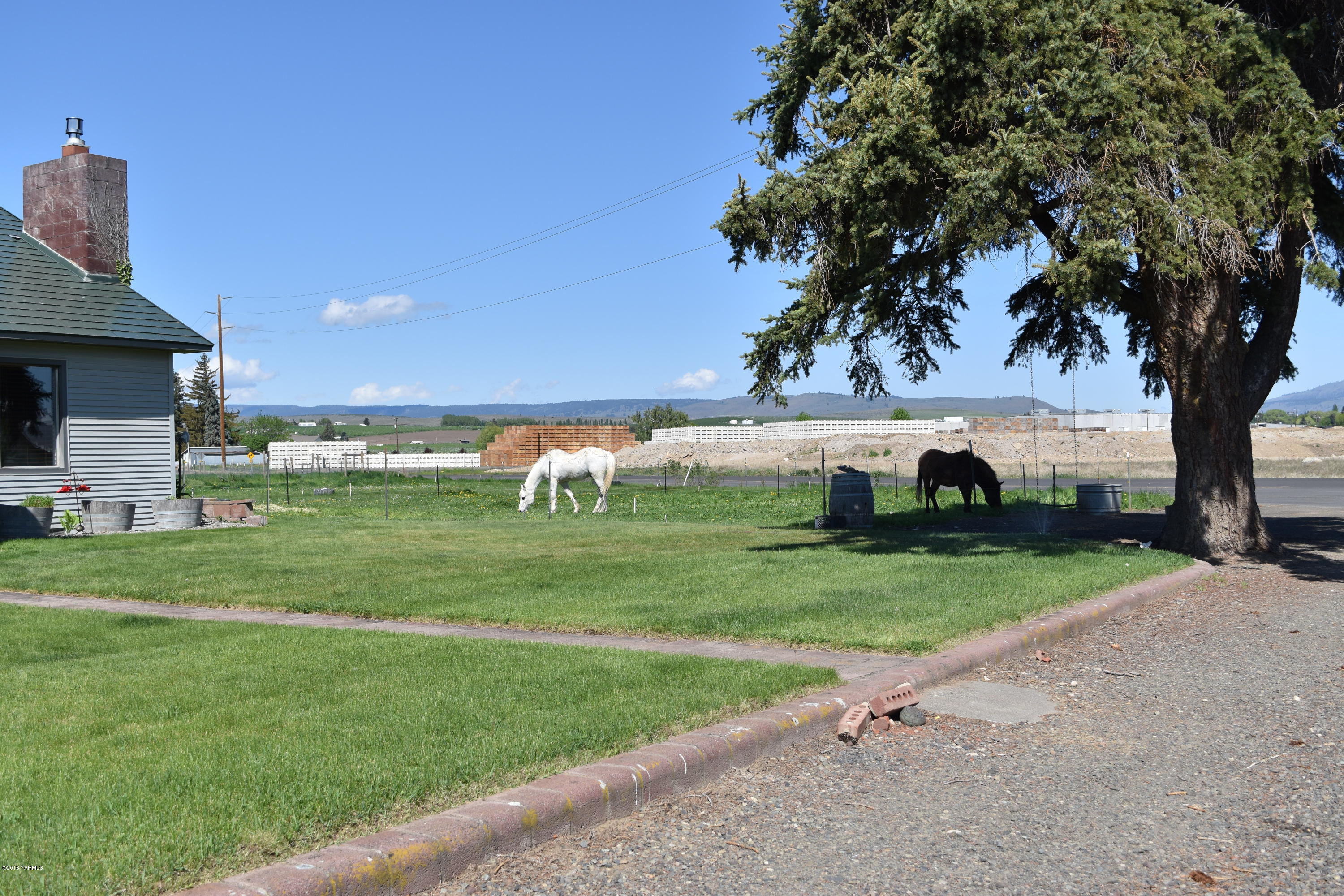 2000 Hiland Road Tieton, WA 98947 - Photo 2 of 16 a view of backyard with outdoor seating and green space