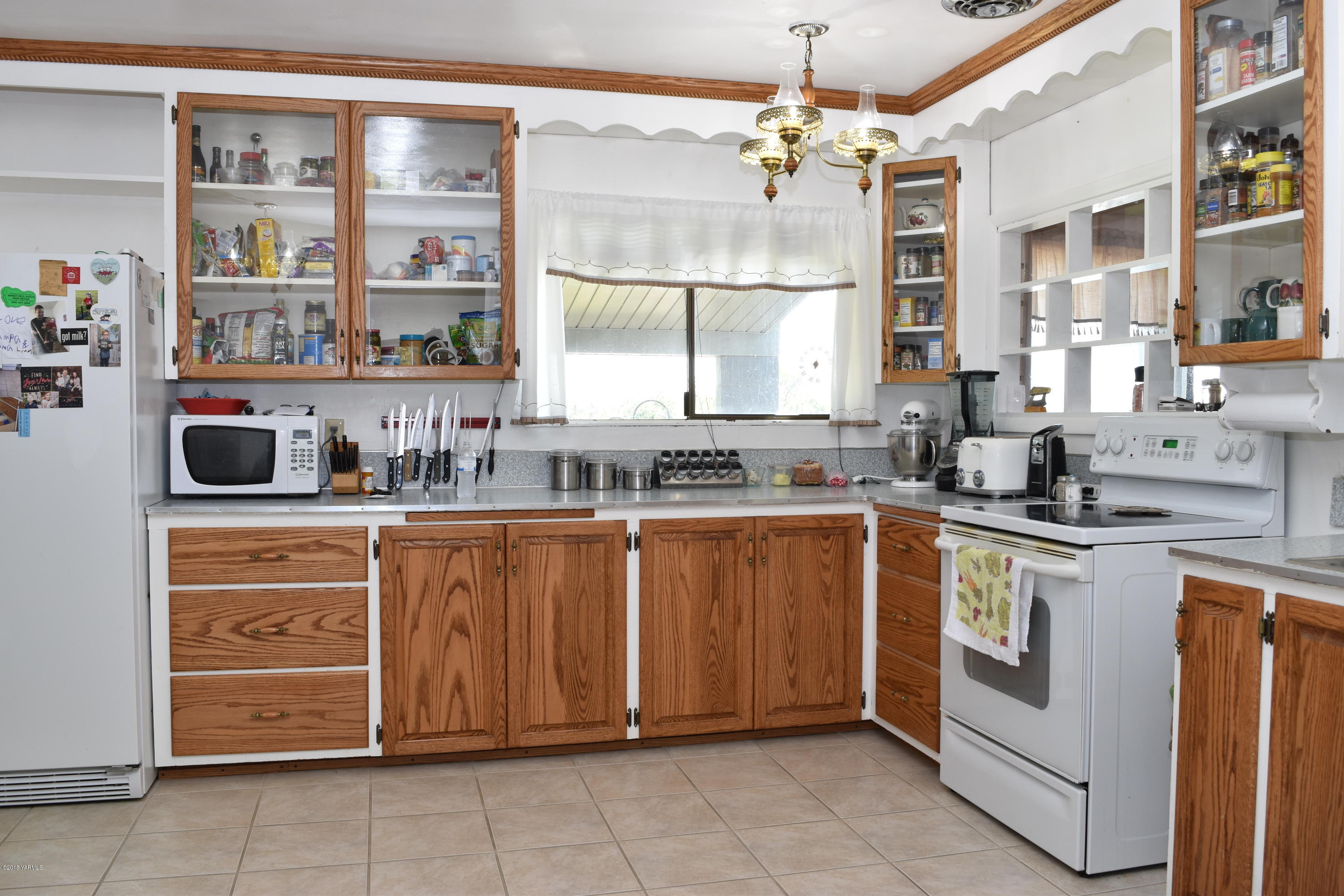 2000 Hiland Road Tieton, WA 98947 - Photo 3 of 16 a kitchen with stainless steel appliances granite countertop a sink and cabinets
