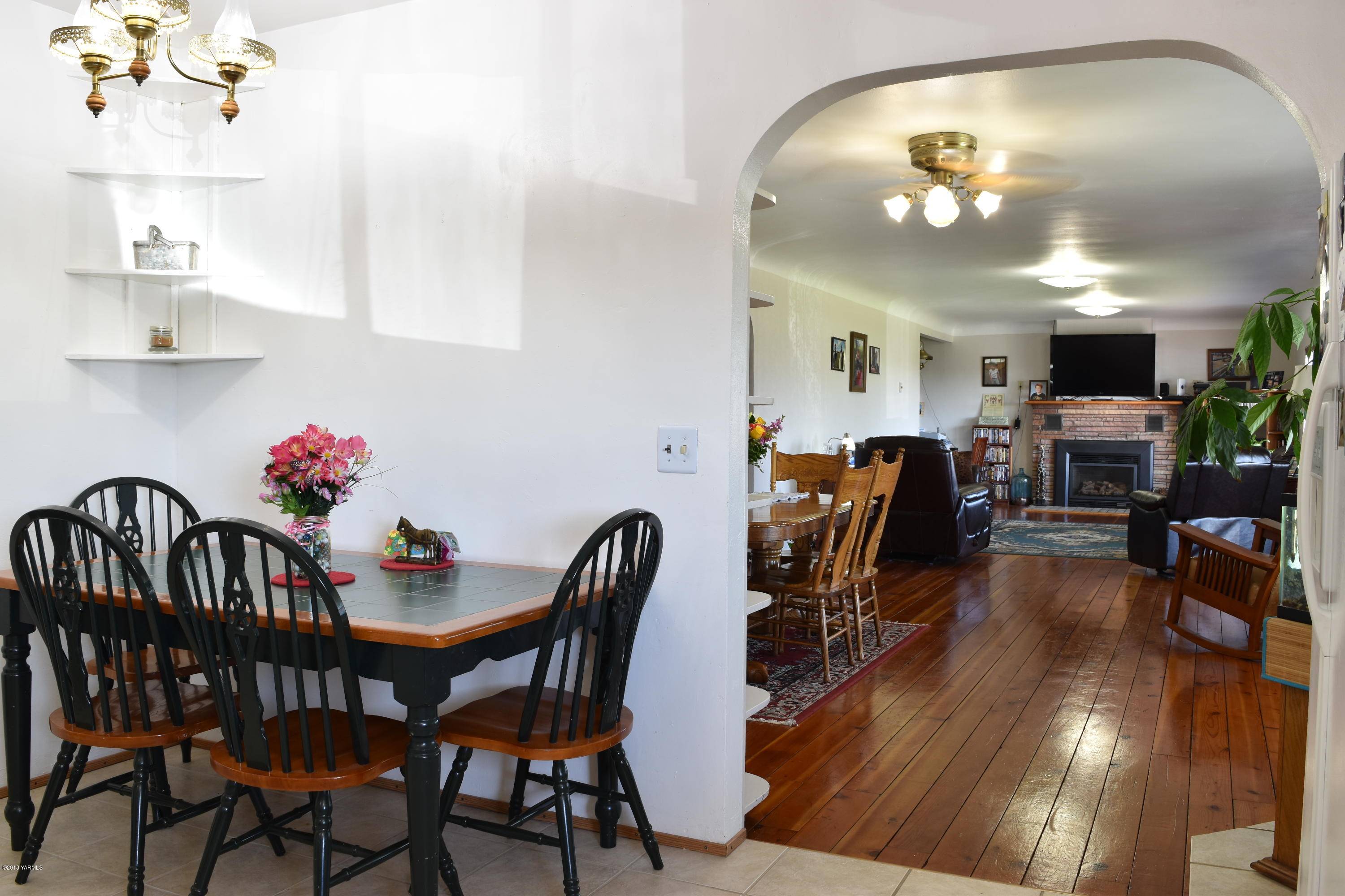 2000 Hiland Road Tieton, WA 98947 - Photo 4 of 16 a view of a dining room with furniture and wooden floor