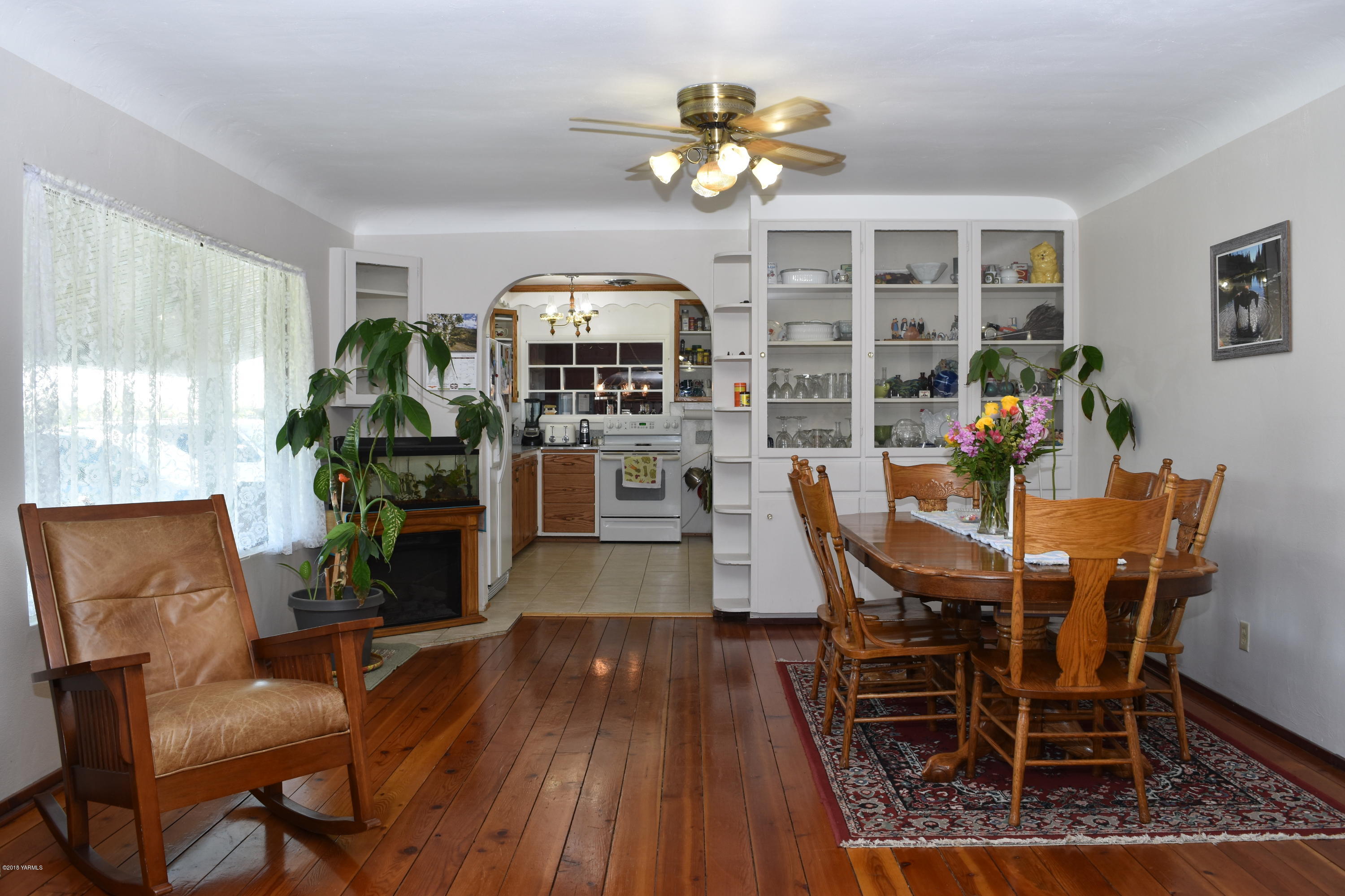 2000 Hiland Road Tieton, WA 98947 - Photo 6 of 16 a view of a dining room with furniture a chandelier and wooden floor