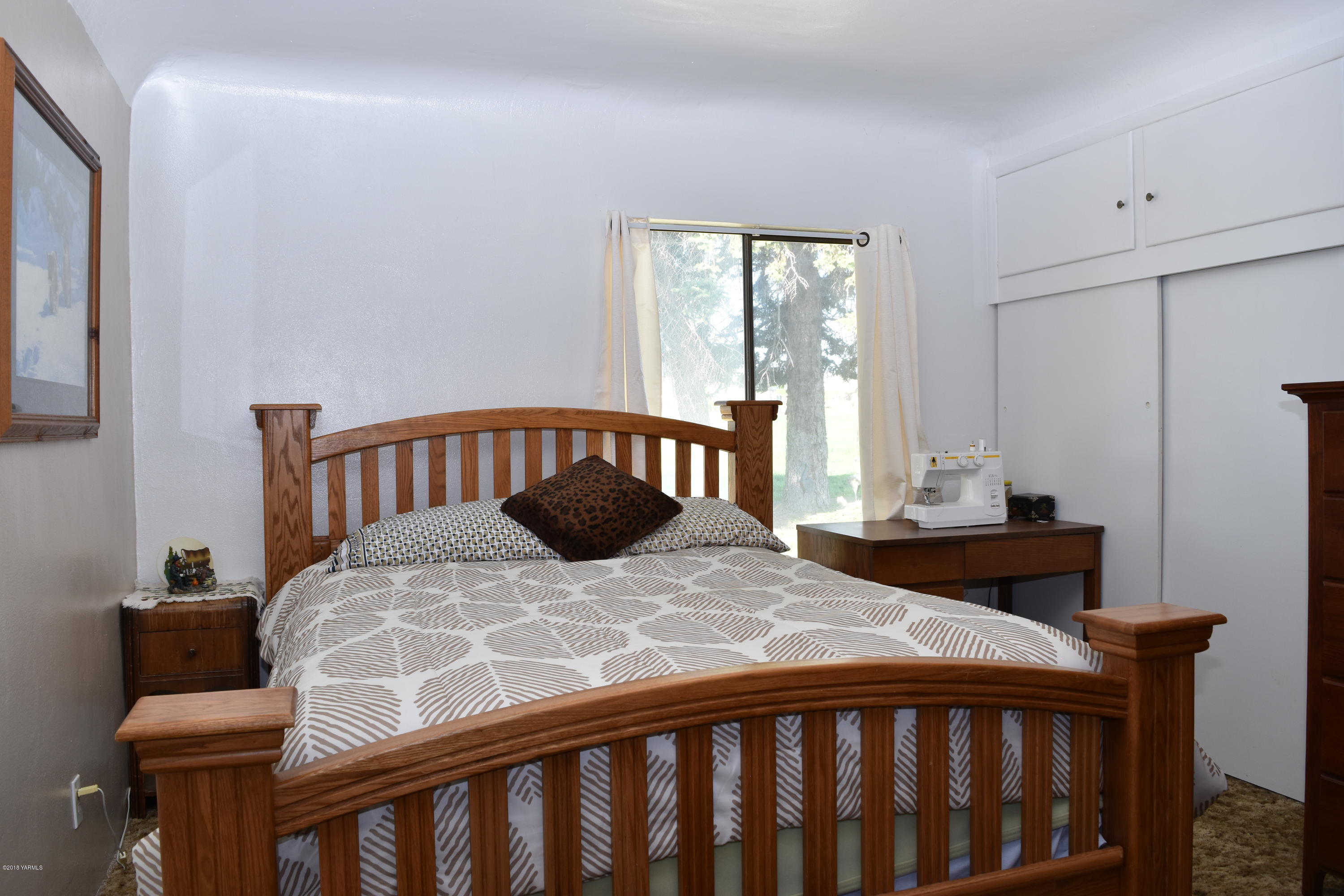 2000 Hiland Road Tieton, WA 98947 - Photo 7 of 16 a bedroom with a bed and a window