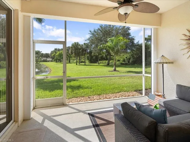 a view of a porch with furniture and garden