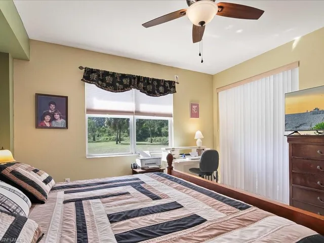 a bedroom with furniture and a window