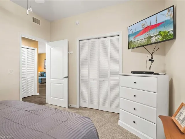 a view of a bedroom with cabinet