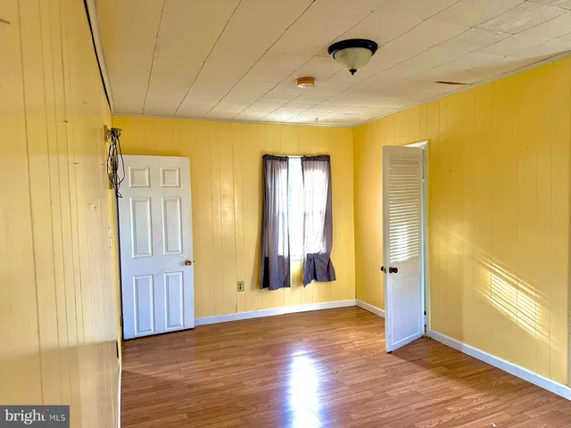 a view of a bathroom with wooden floor
